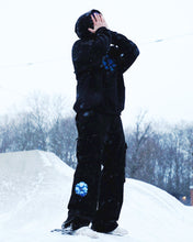 Load image into Gallery viewer, Man wearing black Bubbles Cargos, and black Bubbles Hoodie