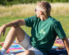 Load image into Gallery viewer, Man wearing green friends t-shirt with sunglasses
