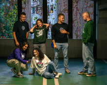 Load image into Gallery viewer, group wearing oversized green, black and white roboflower onecolor, roboflower v2 and roboflower v3 t-shirt, and oversized purple, green and black roboflower onecolor hoodies, roboflower v2 and roboflower v3 sweaters