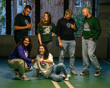 Load image into Gallery viewer, group wearing oversized green black and white roboflower onecolor roboflower v2 and roboflower v3 t-shirt and oversized purple green and black roboflower onecolor hoodies roboflower v2 and roboflower v3 sweaters laughing together
