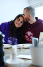 Load image into Gallery viewer, man kissing woman wearing red and purple love bubbles valentines hoodie