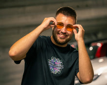 Load image into Gallery viewer, man smiling wearing black roboflower v2 graphic t-shirt
