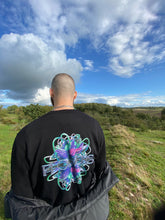 Load image into Gallery viewer, man wearing black roboflower v2 graphic sweater with black breakout vest, back graphic closeup on roboflower v2 sweater