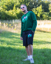 Load image into Gallery viewer, man wearing green misfit painted sweater with black misfit painted shorts and sunglasses