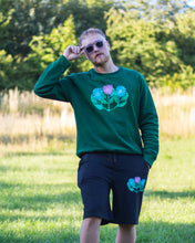 Load image into Gallery viewer, man wearing green misfit painted sweater with black misfit painted shorts and sunglasses 2