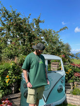 Load image into Gallery viewer, man wearing oversized green friends t-shirt with green shorts and cap