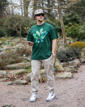Load image into Gallery viewer, man wearing oversized green roboflower t-shirt with jordan 3s