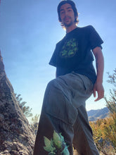 Load image into Gallery viewer, man wearing oversized roboflower cargos with black bubbles t-shirt