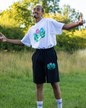 Load image into Gallery viewer, man wearing oversized, tucked in white misfit painted t-shirt with black misfit shorts