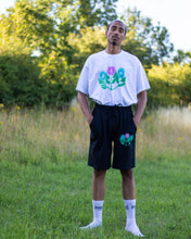 Load image into Gallery viewer, man wearing oversized white misfit painted t-shirt with black misfit shorts