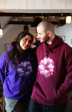 Load image into Gallery viewer, man wearing red love bubbles valentines hoodie, woman wearing purple oversized love bubbles valentines hoodiewhile looking romantically in each others eye