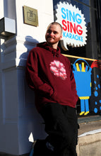 Load image into Gallery viewer, man wearing red oversized love bubbles valentines hoodie with black bubbles cargos