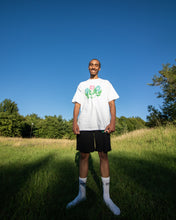 Load image into Gallery viewer, man wearing white oversized misfit t-shirt while smiling
