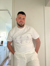 Load image into Gallery viewer, man wearing white thinker t-shirt with white linen pants