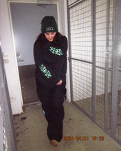 Load image into Gallery viewer, woman wearing black oversized growth longsleeve showing both sleeve graphics