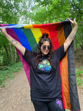 Load image into Gallery viewer, woman wearing oversized black rainbow bubbles pride t-shirt with pride flag and black euphoria shorts