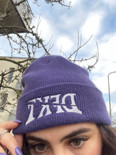 Load image into Gallery viewer, woman wearing purple DFKT logo beanie with purple nails