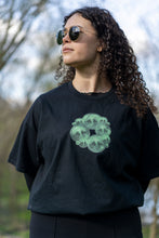Load image into Gallery viewer, woman wearing tucked in, oversized black tree of life t-shirt