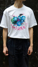 Load image into Gallery viewer, Man wearing white oversized human nature graphic t-shirt with black cargos