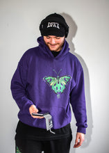 Load image into Gallery viewer, man wearing black DFKT logo dad hat cap with purple ripped butterfly hoodie