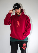 Load image into Gallery viewer, man wearing black DFKT logo dad hat cap with red mindcontrol hoodie