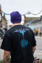 Load image into Gallery viewer, man wearing purple DFKT logo beanie with oversized black roots t-shirt