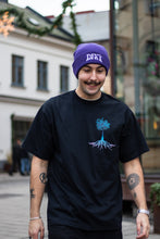 Load image into Gallery viewer, man wearing purple DFKT logo beanie with oversized black roots t-shirt while smiling
