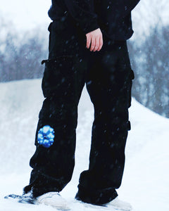 Man wearing black Bubbles Cargos, Love Bubbles Graphic Closeup