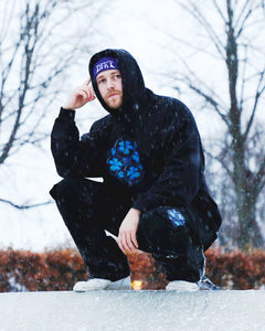 Man wearing black Bubbles Cargos and Black Oversized Bubbles Hoodie