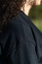 Load image into Gallery viewer, black DFKT t-shirt closeup on stitches