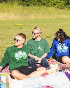 group wearing green misfit sweater, green oversized friends t-shirt and blue oversized lifted living sweater