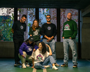 group wearing oversized green, black and white roboflower onecolor, roboflower v2 and roboflower v3 t-shirt, and oversized purple, green and black roboflower onecolor hoodies, roboflower v2 and roboflower v3 sweaters, all smiling