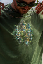 Load image into Gallery viewer, man wearing military green oversized magic mirror graphic t-shirt, showing off snow white inspired graphic 