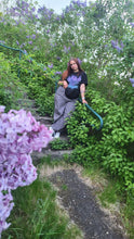 Load image into Gallery viewer, woman customer wearing oversized black plant a seed t-shirt