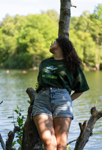 woman wearing a green oversized thermal graphic overload t-shirt