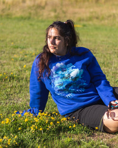 woman wearing blue oversized lifted living sweater