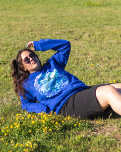 woman wearing blue oversized lifted living sweater