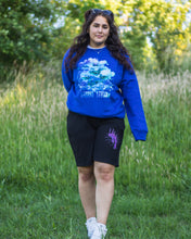 Load image into Gallery viewer, woman wearing blue oversized lifted living sweater with black euphoria shorts