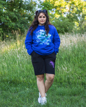 Load image into Gallery viewer, woman wearing blue oversized lifted living sweater with black euphoria shorts