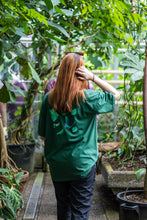 Load image into Gallery viewer, woman wearing green oversized fly outside the jar butterfly graphic t-shirt 