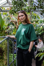 Load image into Gallery viewer, woman wearing green oversized fly outside the jar t-shirt 