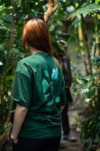 Load image into Gallery viewer, woman wearing green oversized fly outside the jar t-shirt back butterfly graphic