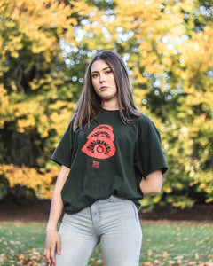 woman wearing green oversized stress t-shirt