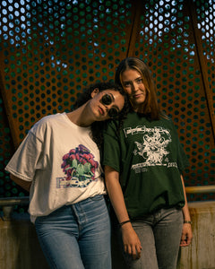 women wearing a green oversized onecolor graphic t-shirt and white oversized roboflower v3 t-shirt