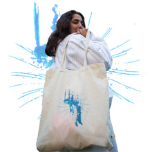 Load image into Gallery viewer, Mockup Model wearing Euphoria tote bag blue graphic