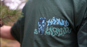 green mindliquid logo t-shirt graphic closeup