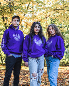 man and women wearing purple lavender graphic hoodies