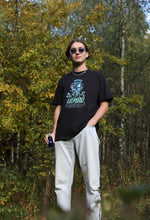 Load image into Gallery viewer, man wearing oversized black mindliquid graphic t-shirt