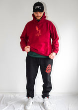 Load image into Gallery viewer, man wearing oversized red mindcontrol hoodie with black DFKT logo dad hat