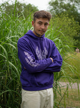 Load image into Gallery viewer, man wearing purple oversized lavender hoodie with sleeve and chest graphic